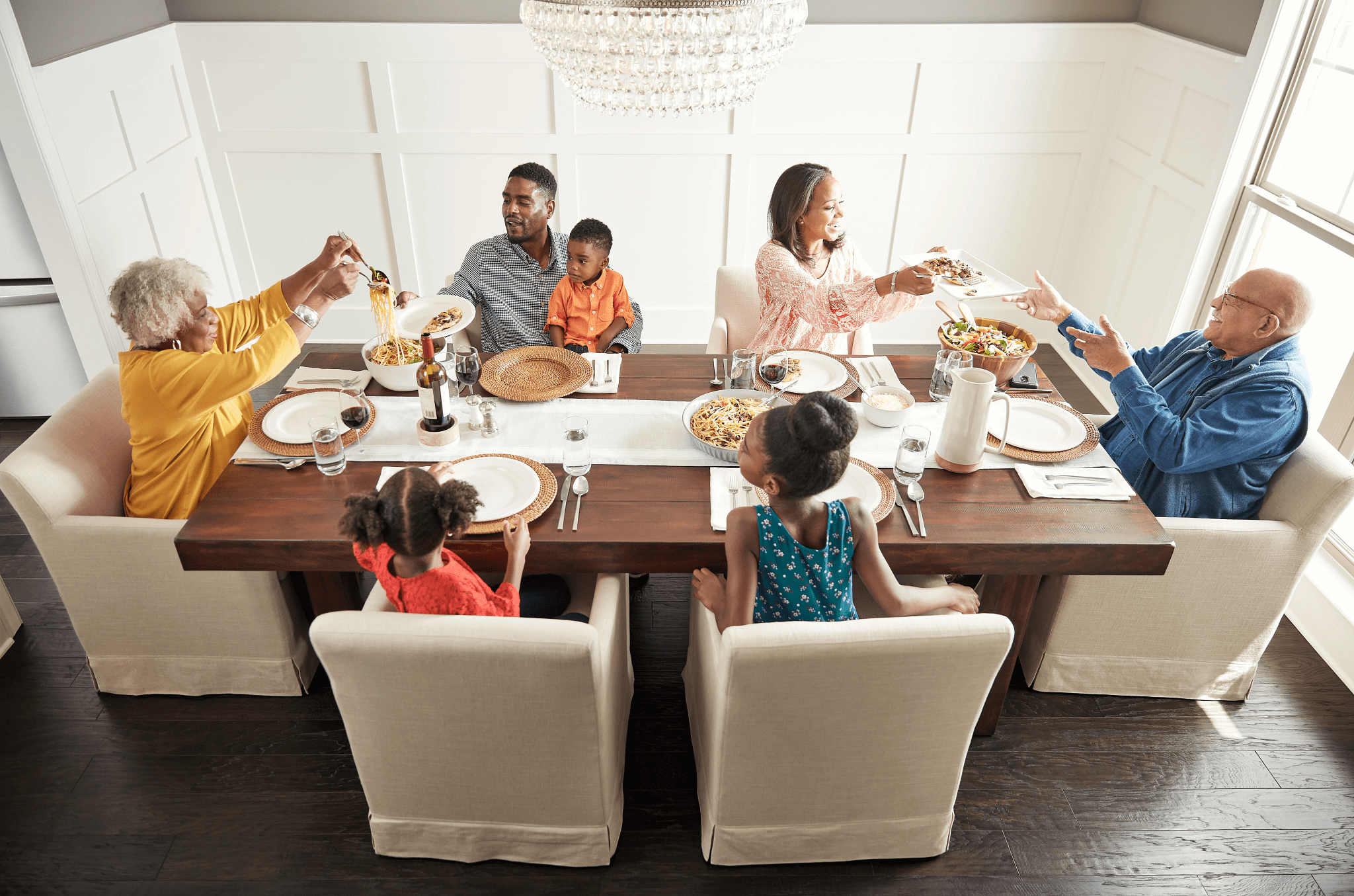 Family having breakfast at the dining table | IQ Floors