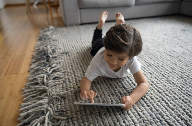 Girl lying on carpet flooring | IQ Floors